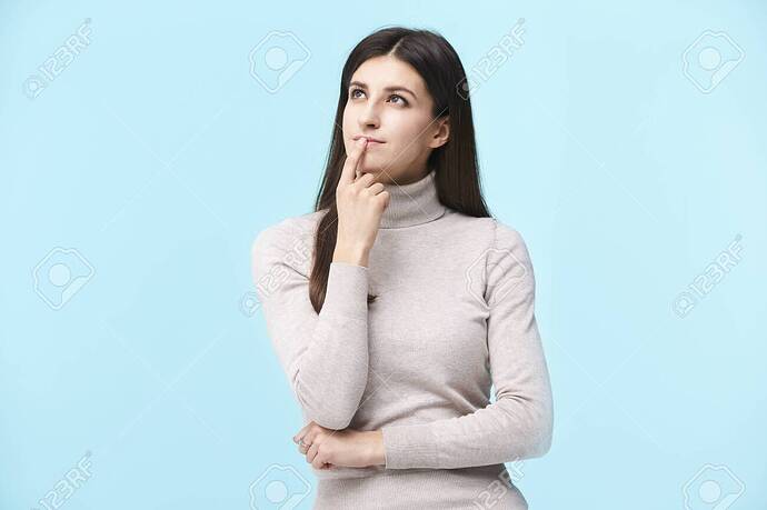 124844916-portrait-of-a-beautiful-young-caucasian-woman-contemplating-finger-on-lip-looking-up-isolated-on