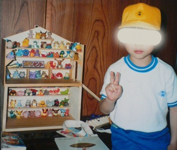 Kid proudly posing with their Pokémon Kid's figure collection, back in the day.